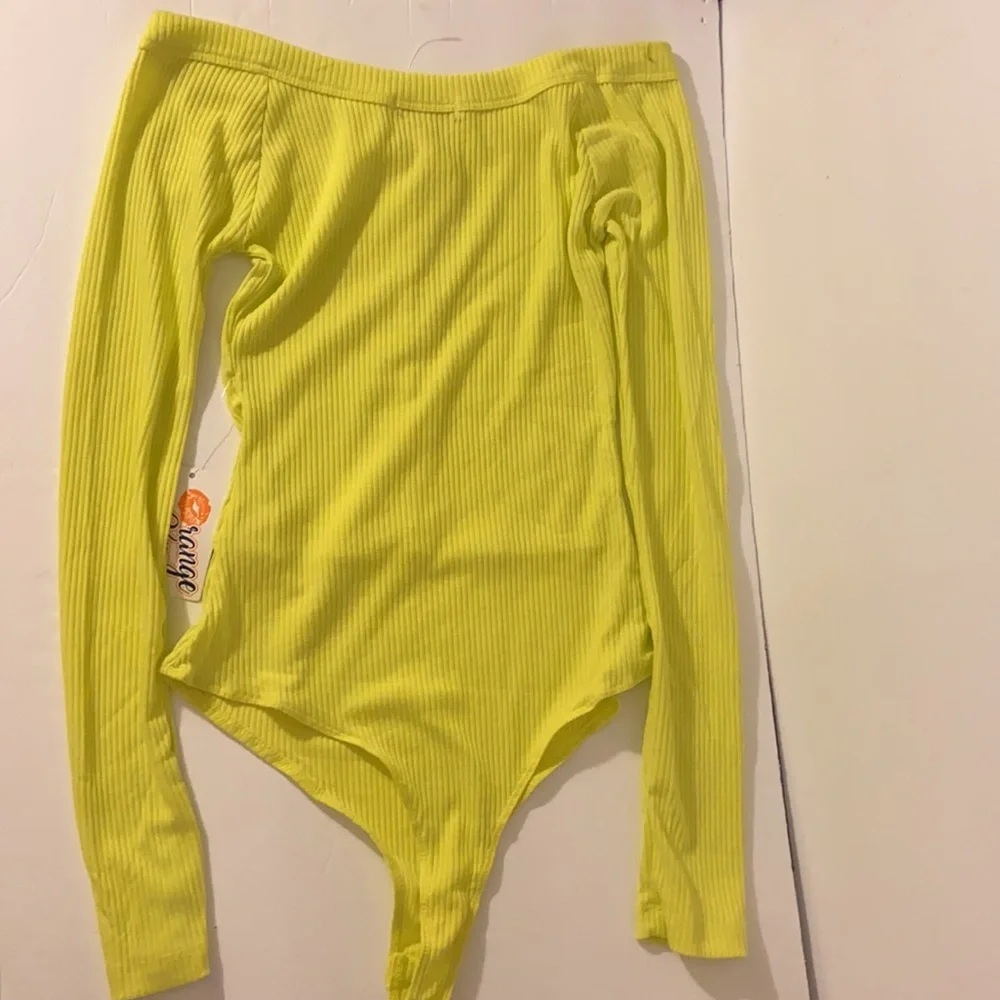 Neon yellow long sleeve sexy body suit. Size small. New with tags